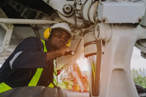 Mechanics inspecting engines of large plane