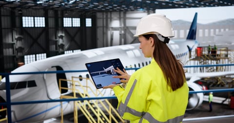 Female aerospace engineer conducting detailed aircraft engine inspection